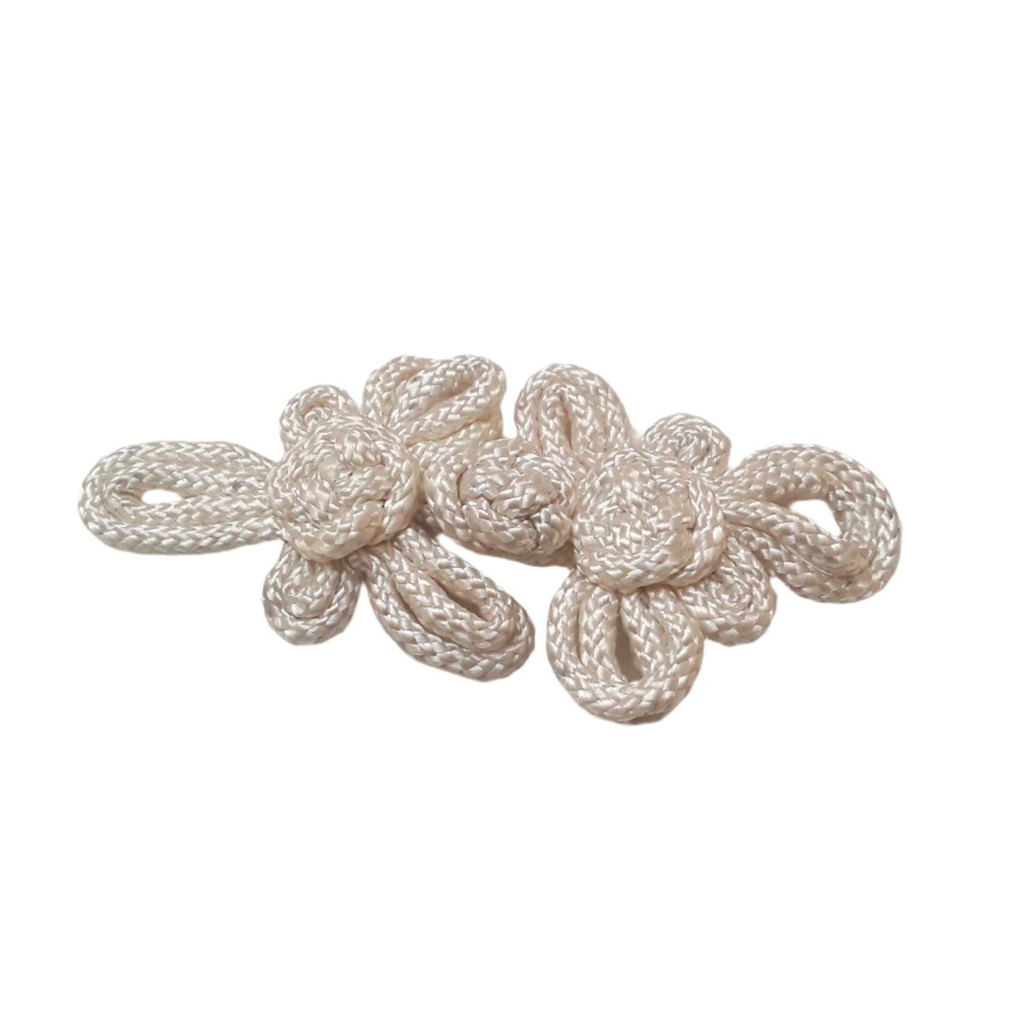 A large 140mm white pajama frog closure made from braided cord with twin knot motifs.