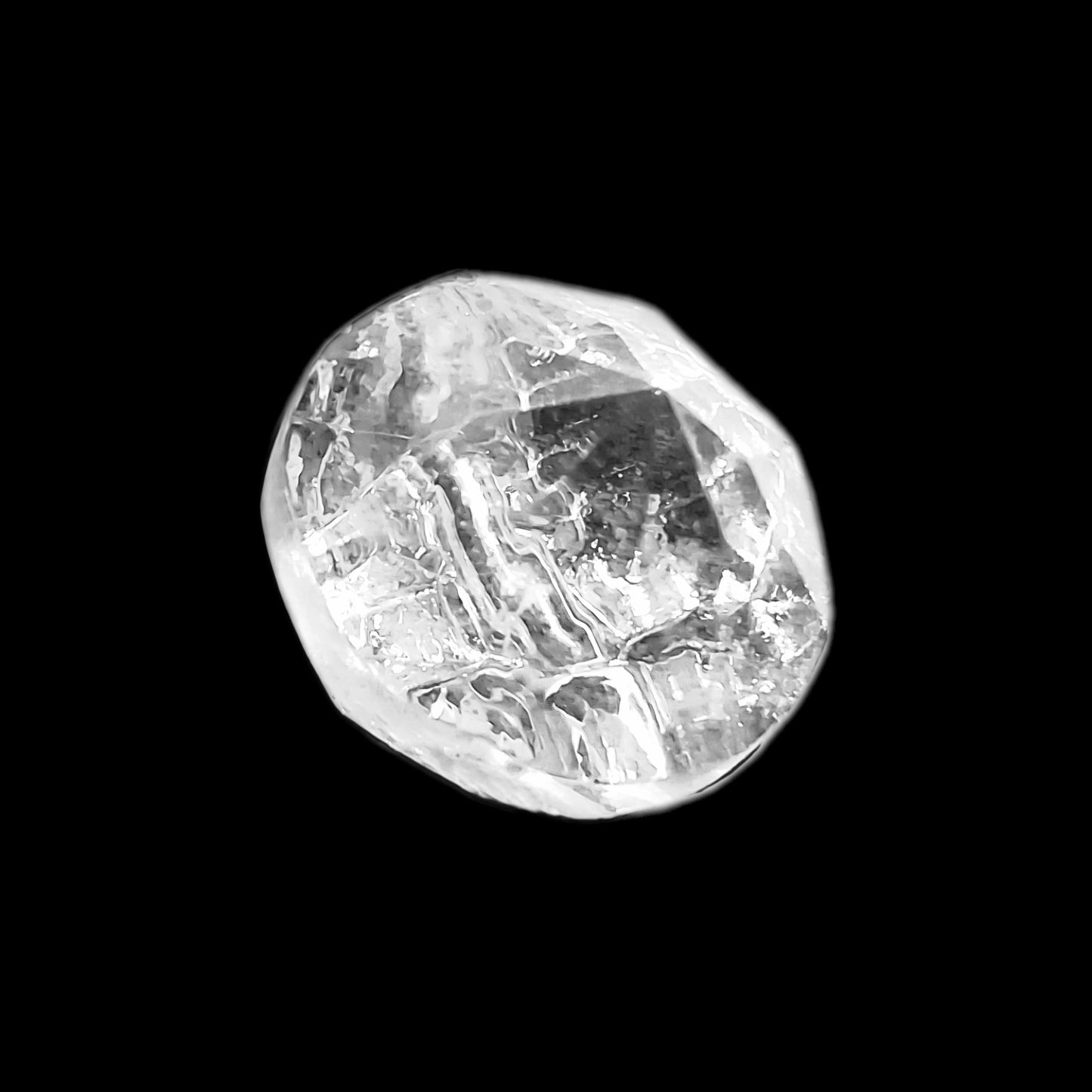 Faceted clear mirrored glass button with irregular rocky, diamond-like surface and pointed profile, channel shank, 14mm/22L.