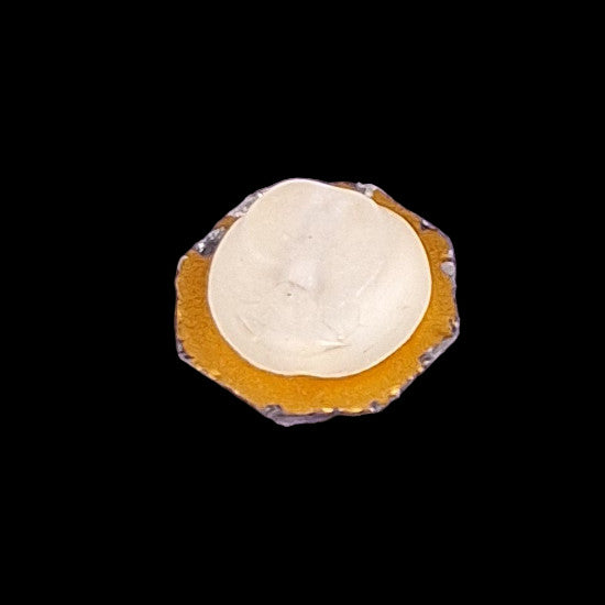 Reverse side of 8-sided mirrored glass button showing mirrored back and frosted glass shank attachment.