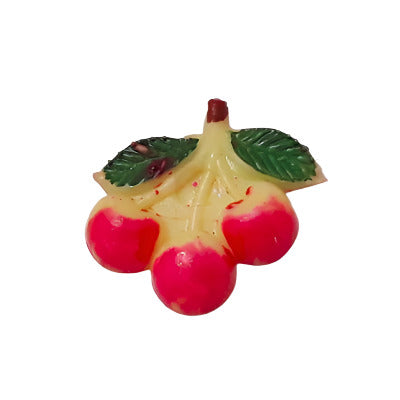 Hand-painted plastic flat back of a bunch of three red cherries with stems and green leaves.