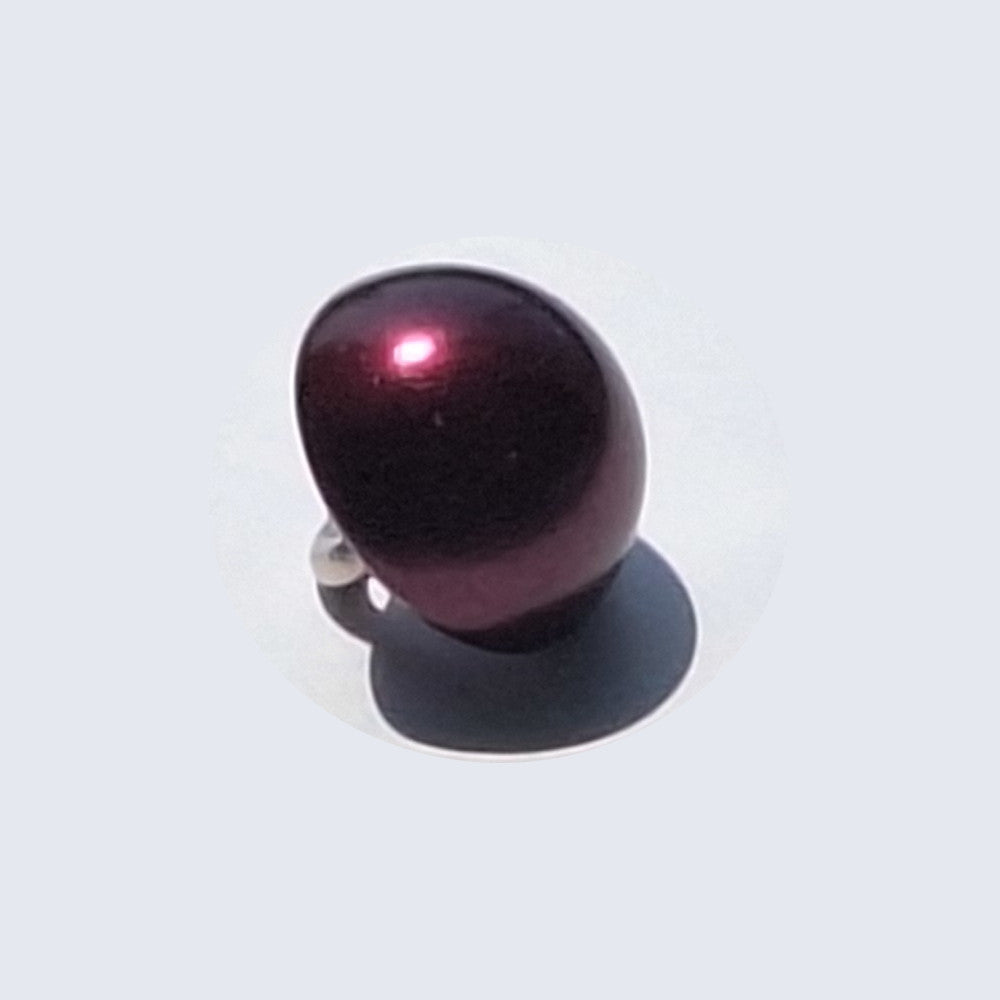 Black pearlized half ball button with screw shank, angled to show curved reflective surface.
