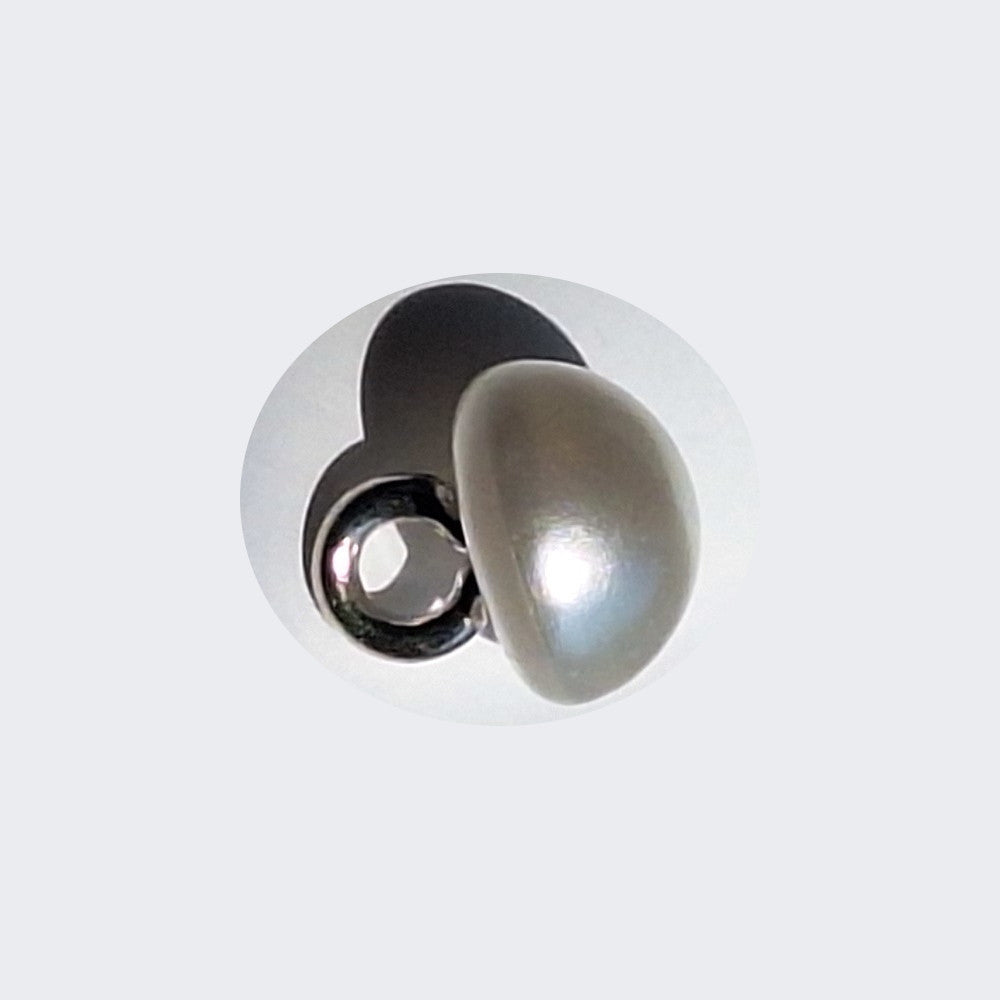 Pearlized half ball button with screw shank, angled to show smooth reflective surface, 8mm.