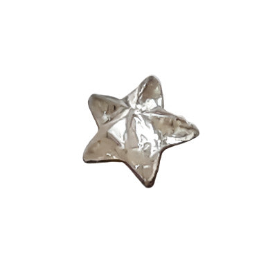 Tiny 5 mm crystal mirrored glass star cabochon shown in close-up.