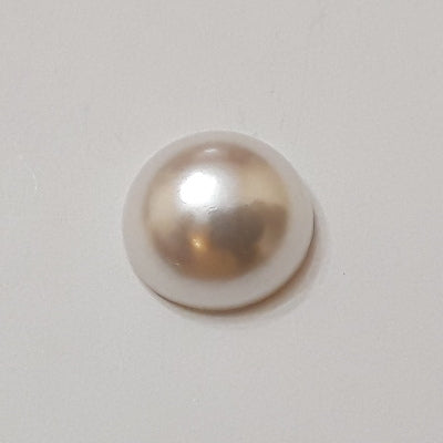 Vintage pearl plastic cabochon with a smooth dome and a flat-back surface, 7mm.
