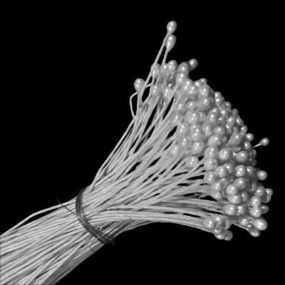 Side-view of a bunch of Single-ended pearl pep ornament with small pearl head on wire stem