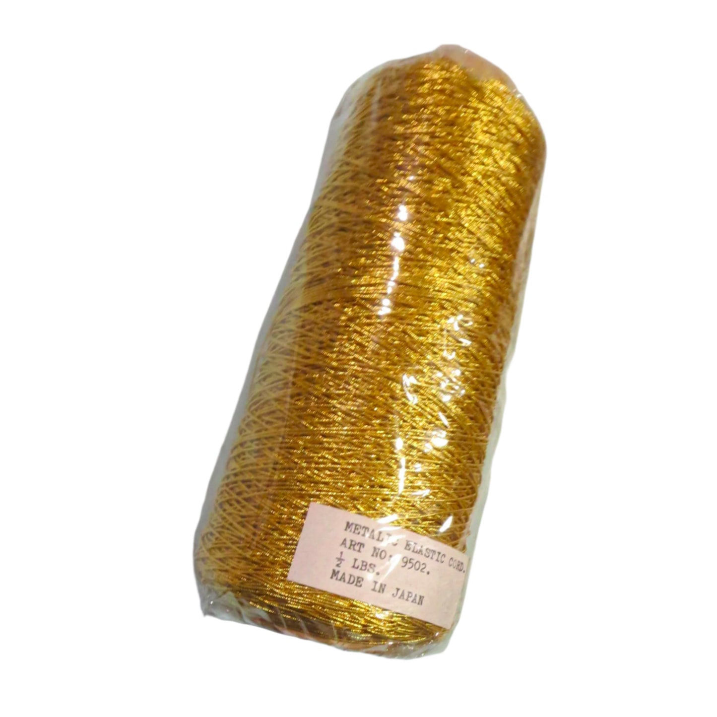 Gold elastic cord wound on a half-pound cone