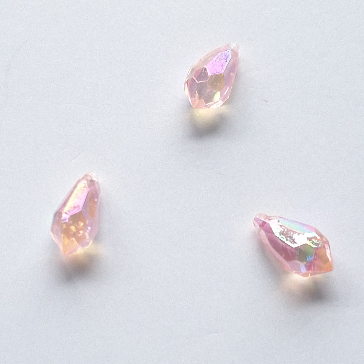 Three AB faceted plastic drop in Pink, translucent, sew-on, 6.5x13mm.
