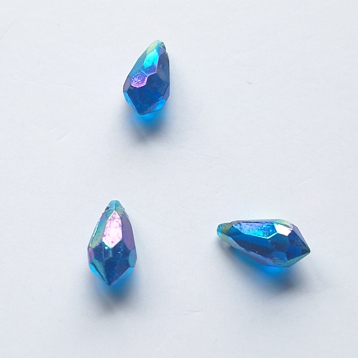Three AB faceted plastic drop in Sapphire, translucent, sew-on, 6.5x13mm.