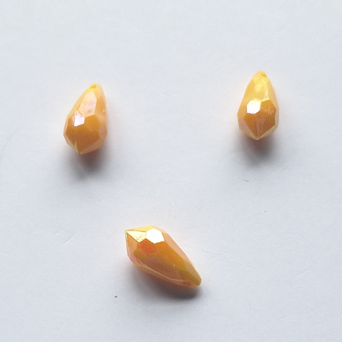 Three AB faceted plastic drop in Yellow, opaque, sew-on, 6.5x13mm.