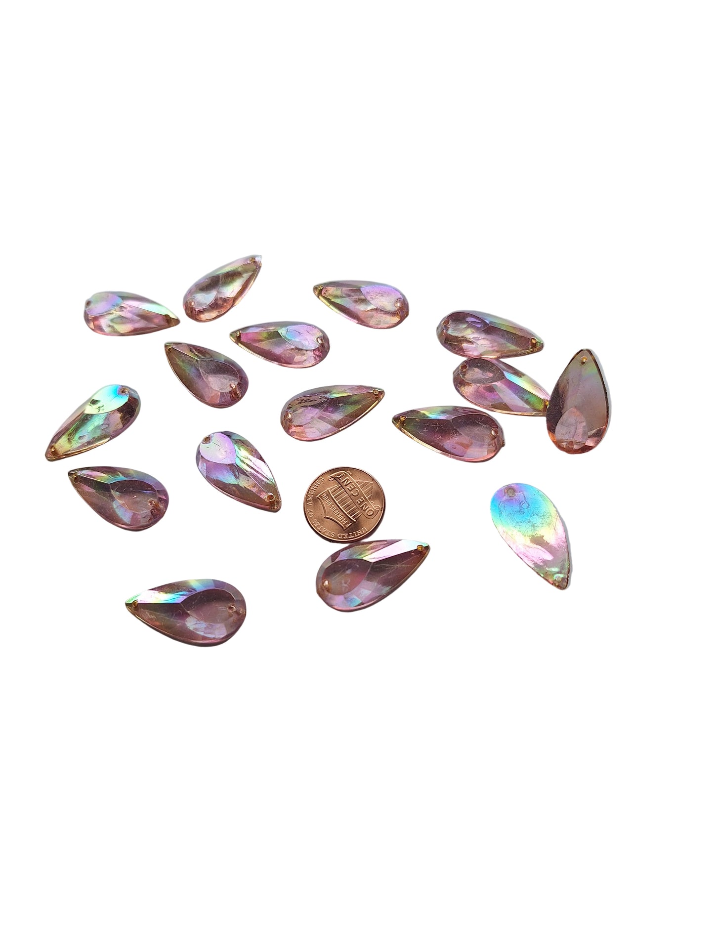 Group photo of vintage amethyst AB acrylic teardrop cabochons, table-cut with two-hole sew-on flat back, 14×27 mm. Shown with penny for scale.