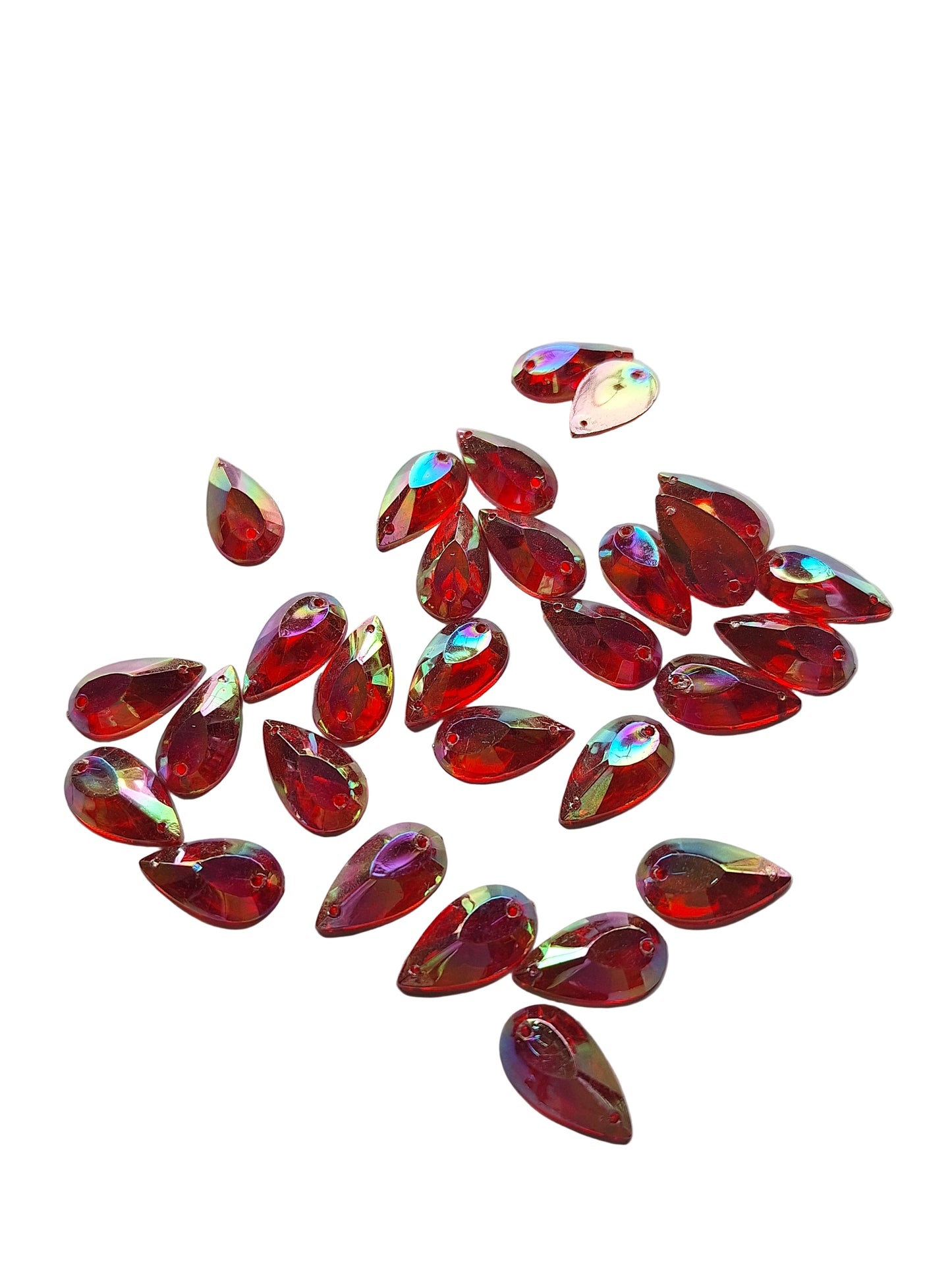 Ruby AB teardrop cabochons shown in a group, including one flipped to display the sew-on back, with a penny for scale.