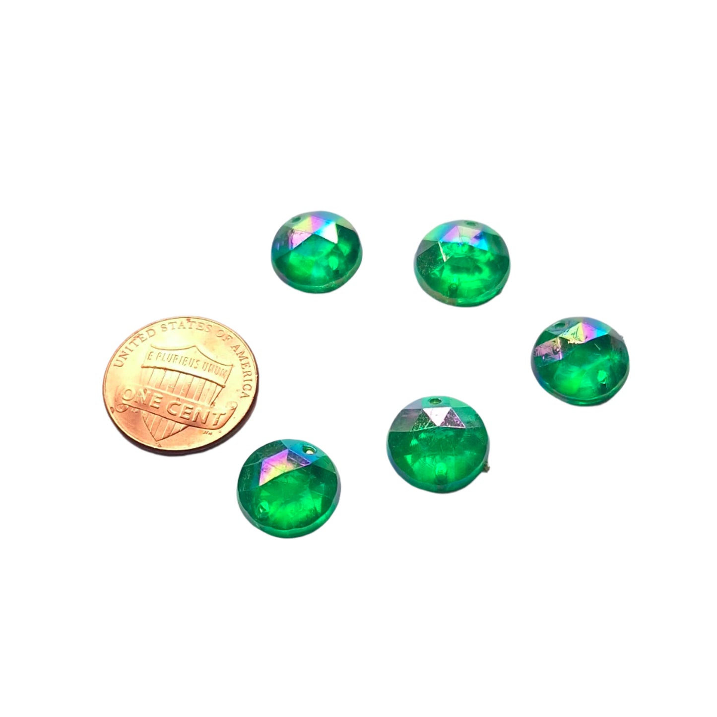 Emerald AB round faceted cabochons arranged in a group of five, with a penny included for scale.