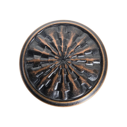 Antique-finish stamped brass shank button with a radiating starburst design, raised center detail, and textured radial surface.