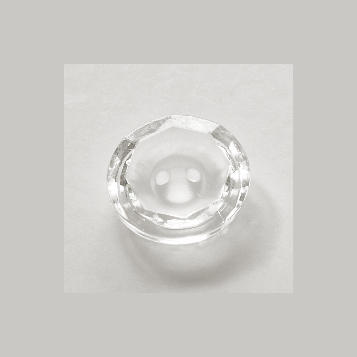 2-hole octagonal crystal glass button with concave frosted center 11.4mm