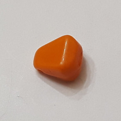Orange glass kernel drop with smooth rounded shape and side-drilled hole, 8×10 mm.