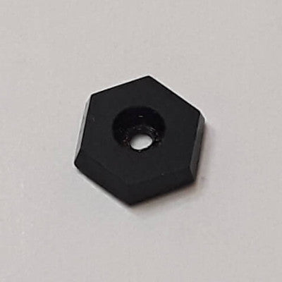 Small black hexagonal glass spacer bead, 7×8 mm, table-cut with a center hole and a reflective polished surface.