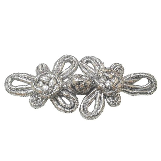 A large 140mm silver pajama frog closure made from braided cord with twin knot motifs.
