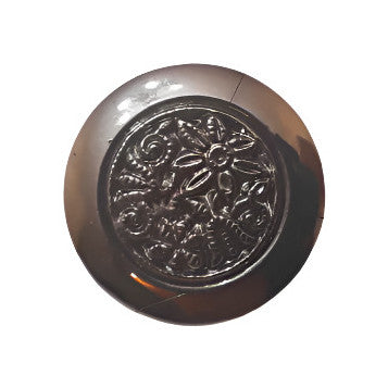 Silver metalized shank button with raised floral center, smooth beveled rim, and slight dome, 18mm.