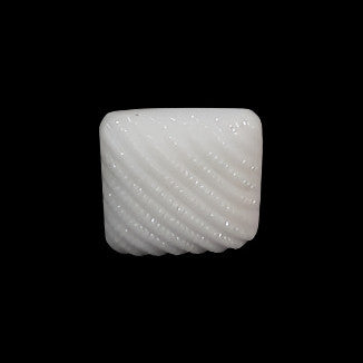 White square glass button with diagonal ribbed texture, shown in close-up on black background.