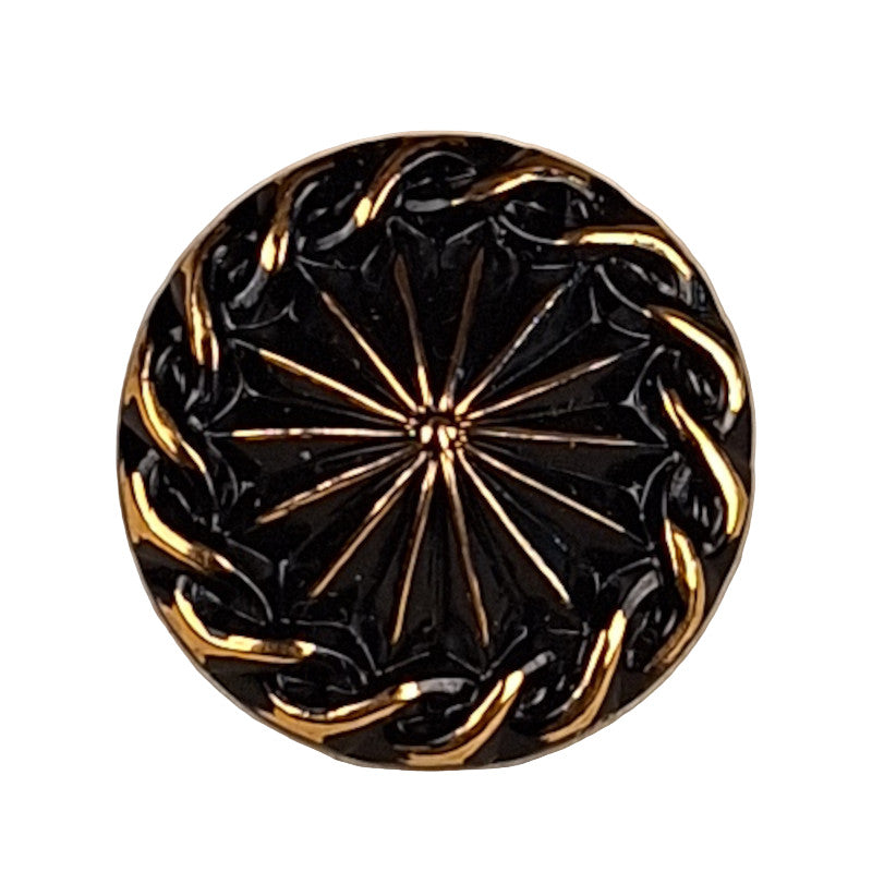 black and gold glass button with a raised center and rope-like edge