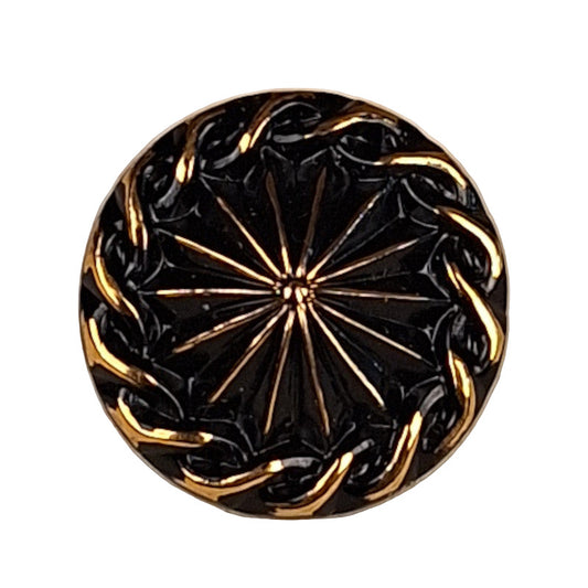 black and gold glass button with a raised center and rope-like edge