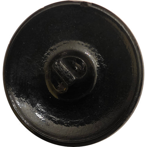 Close-up photo of the back of a larger round black faceted glass button with a concave surface.