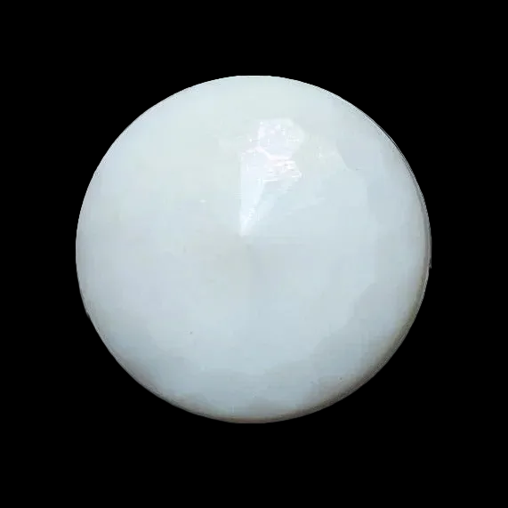 Close-up photo of a round white faceted glass button in the medium 18mm size with soft reflections highlighting the facets.