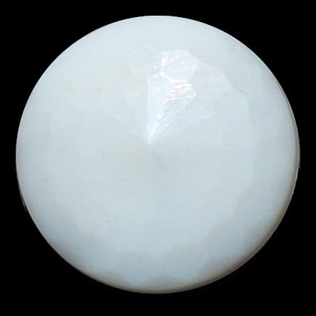 Close-up photo of a larger round white faceted glass button in 23mm size showing the full faceted dome against a black background.