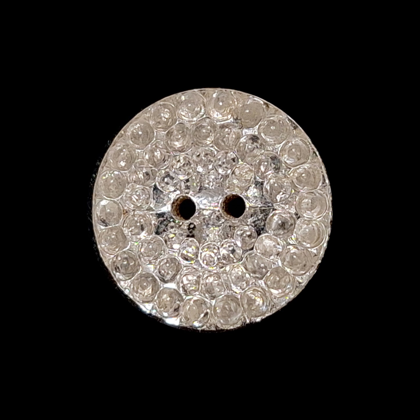 Mirrored glass button with a pebbled textured surface and two-hole sewing attachment, 14mm.
