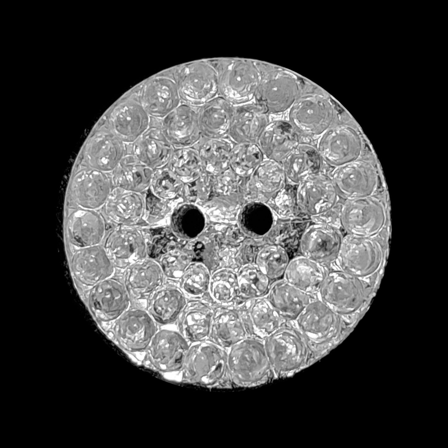 Mirrored glass button with a pebbled textured surface and two-hole sewing attachment, 19mm.