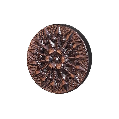 Purple metalized button with raised starburst design and geometric detailing radiating from a central flower, shank back, 14mm.