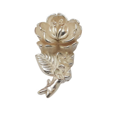 Silver metalized plastic flat back, left-facing long stemmed rose, 12×25mm, vintage Japanese 1950s.