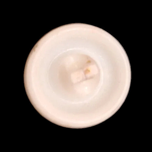 Back of white glass button with gold luster stars
