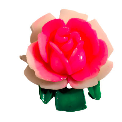 Plastic flat back of a pink rose with green stem on a white background, 18mm