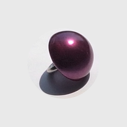 Purple pearlized half ball button with screw shank, angled to show curved reflective surface.