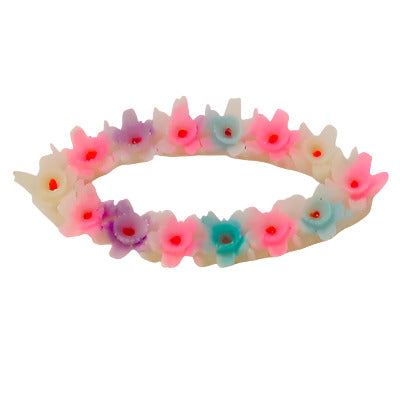 Oval wreath plastic flat back with pastel colored flowers on a white background