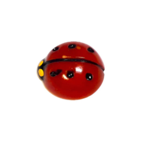 Hand-painted flat back of a red ladybug with black dots and yellow eyes on a white background.