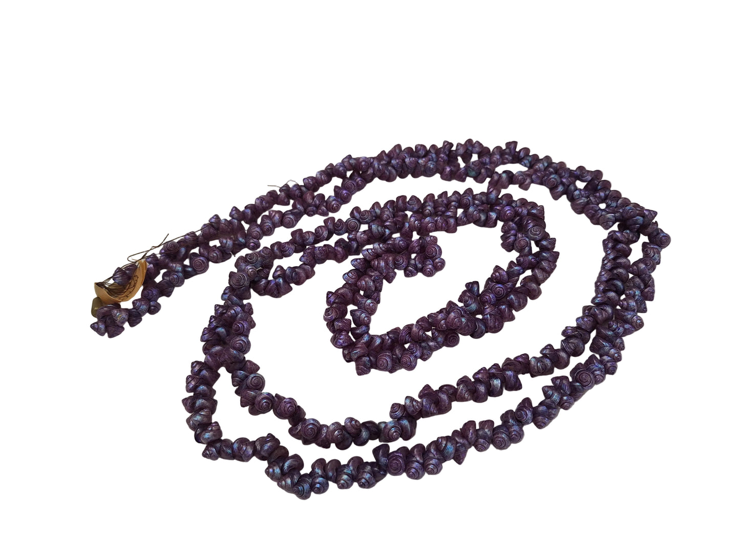 Purple strung seashells with hand-punched holes and natural 1/4-inch shells shown on complete strand.