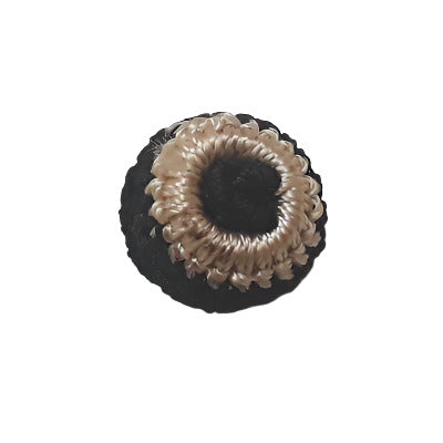 Black and white crocheted button with a textured black yarn center and a smooth silky white outer band, shown in 15mm size.