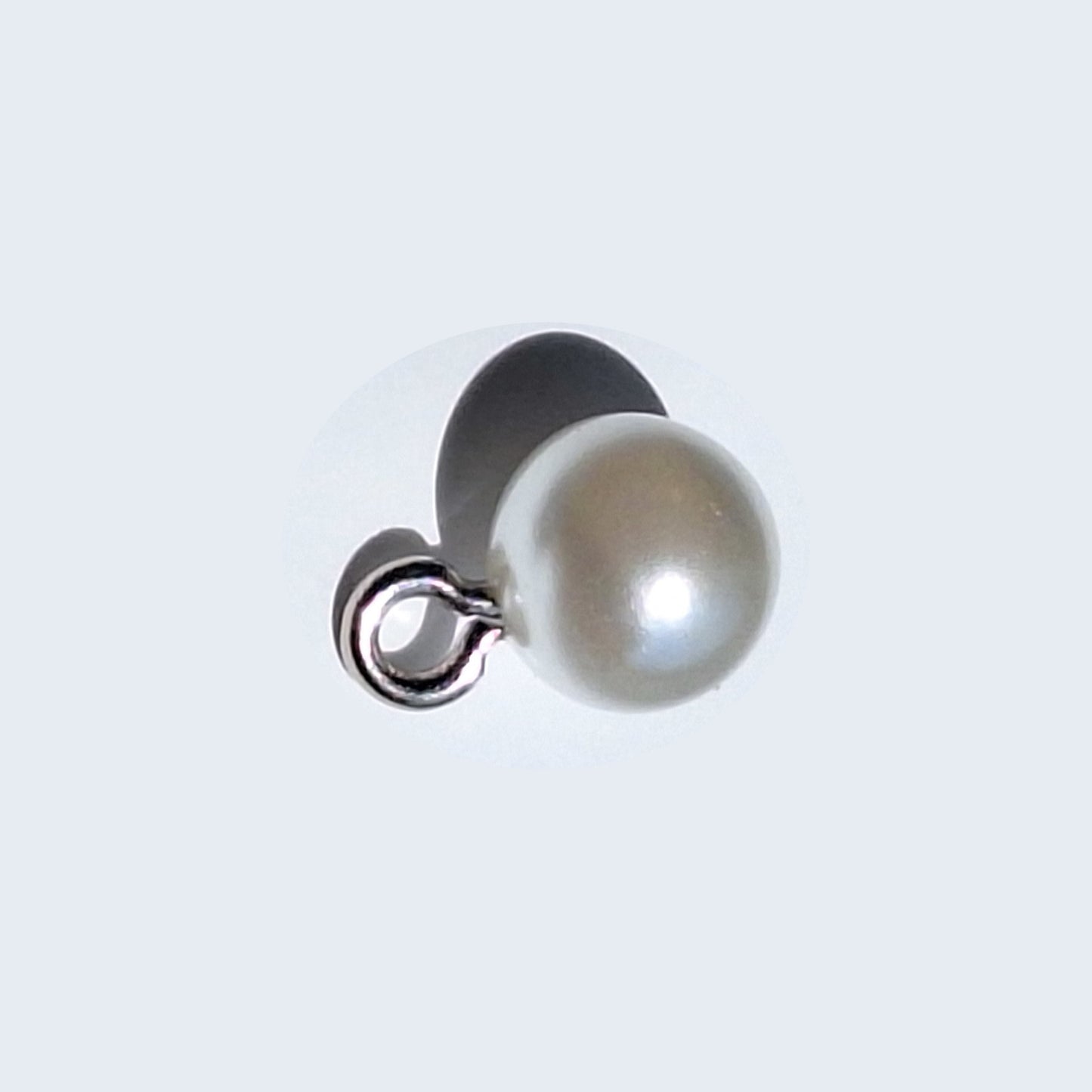 Pearlized full ball button with reflective finish and screw shank, shown in close-up for detail, 8mm.