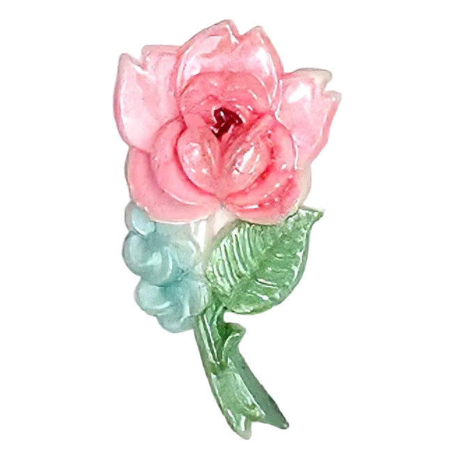 Large vintage hand-painted plastic floral flatback featuring a pink rose with green and pale aqua leaves Stem facing right. 19x36mm