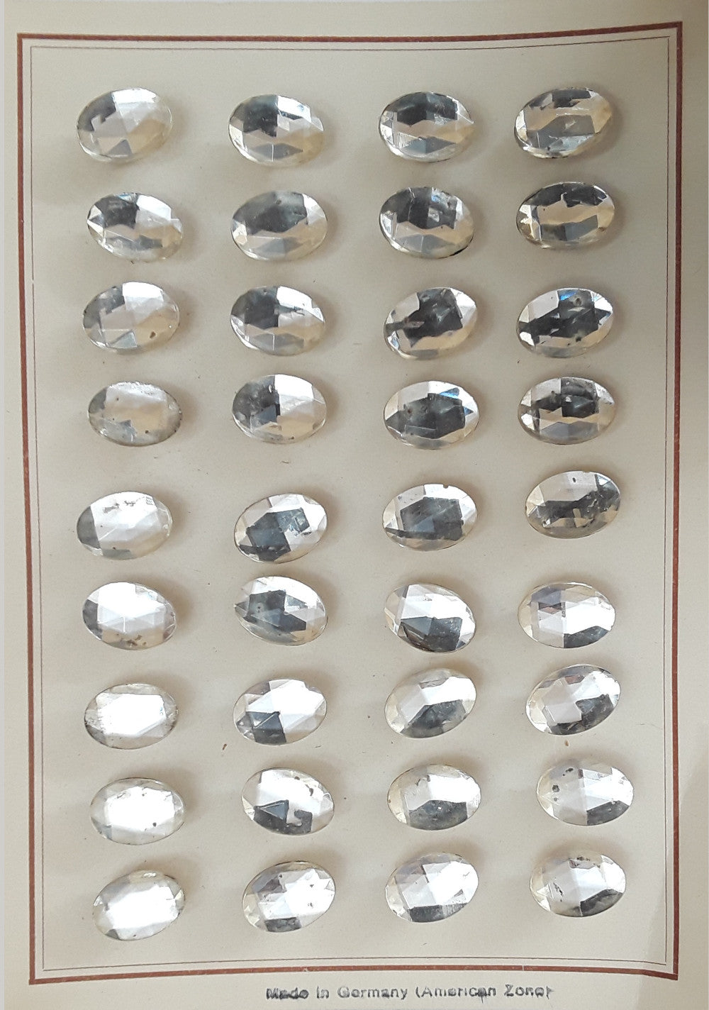 Button card of 36 mirrored glass buttons with oval jeweled design, 14mm