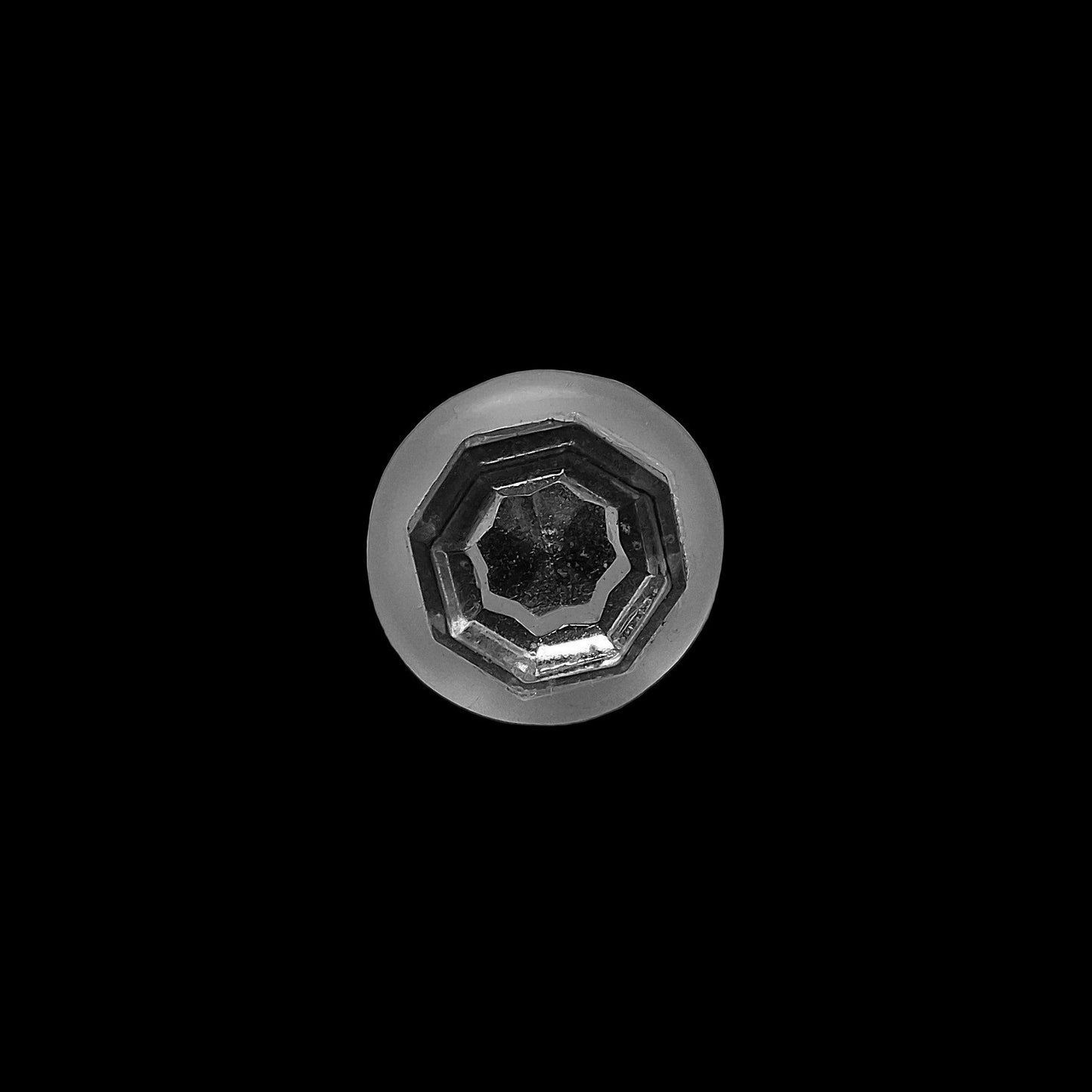 Mirrored glass button with raised hexagonal center inside frosted shell, 9mm