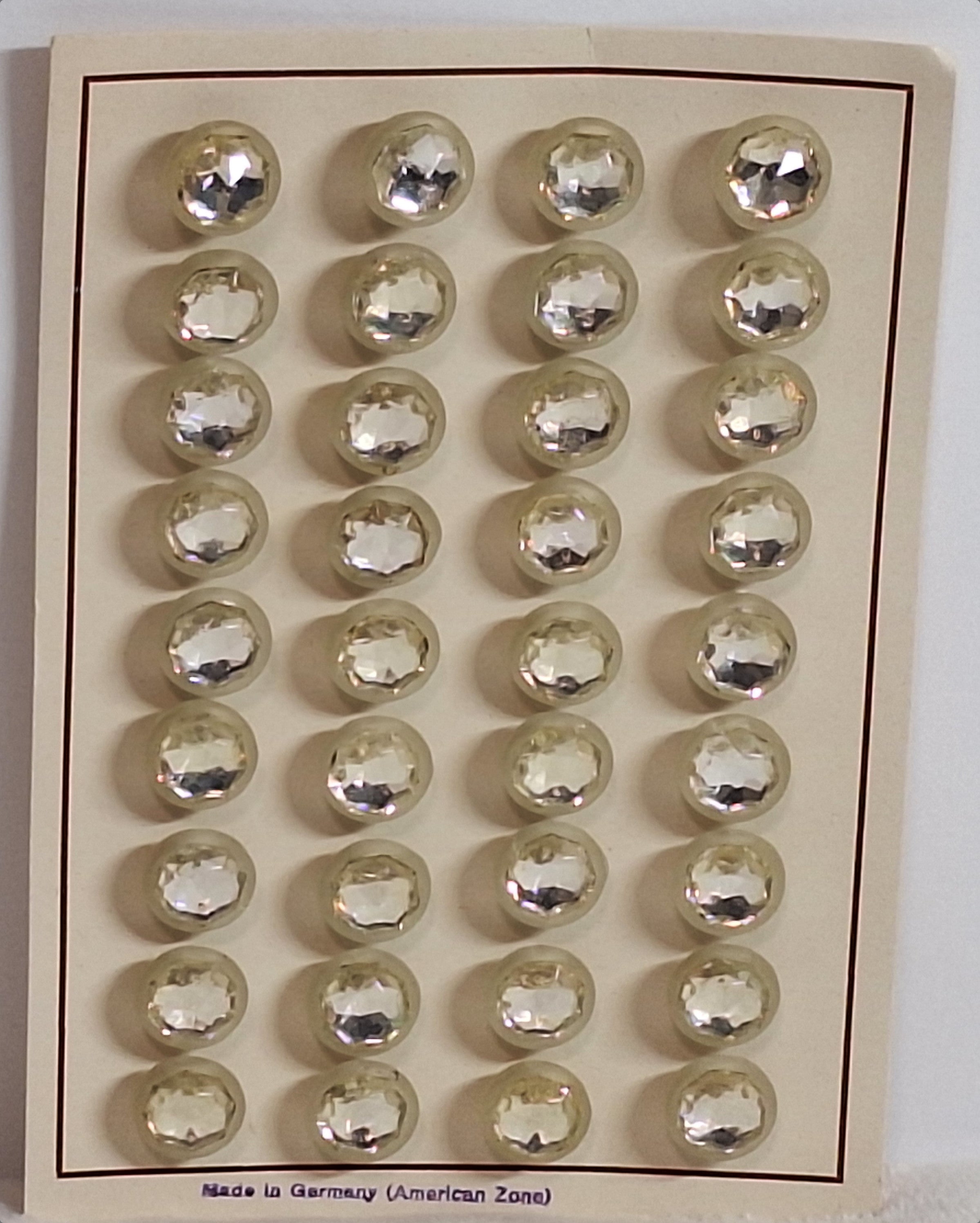 Button card of 24 mirrored glass buttons with faceted octagonal center set in frosted shell, 14mm