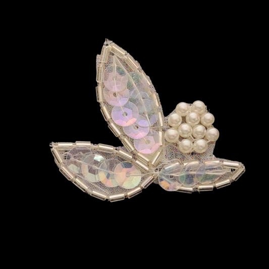 Three-petal vintage applique made from iridescent AB sequins and silver bugle beads with a cluster of small faux pearls at the center, sewn onto a fine mesh backing.