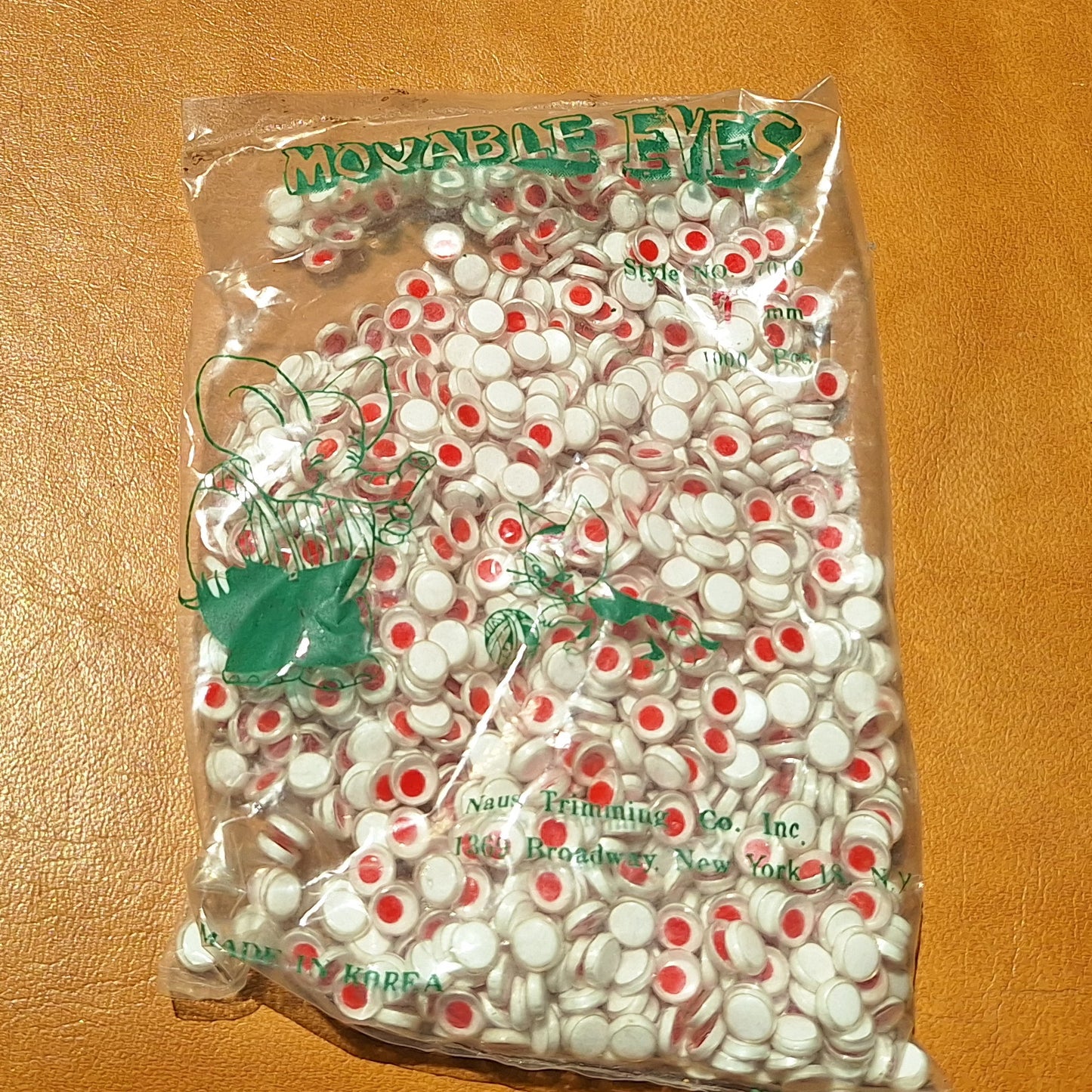 Bag of 1000 7mm plastic moveable flat back eyes with red pupils, made in Korea.