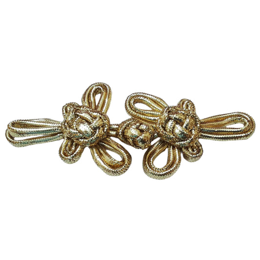 A large 140mm gold pajama frog closure made from braided cord with twin knot motifs.