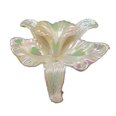Pearlized white plastic orchid flat back with AB finish, 22×27 mm.
