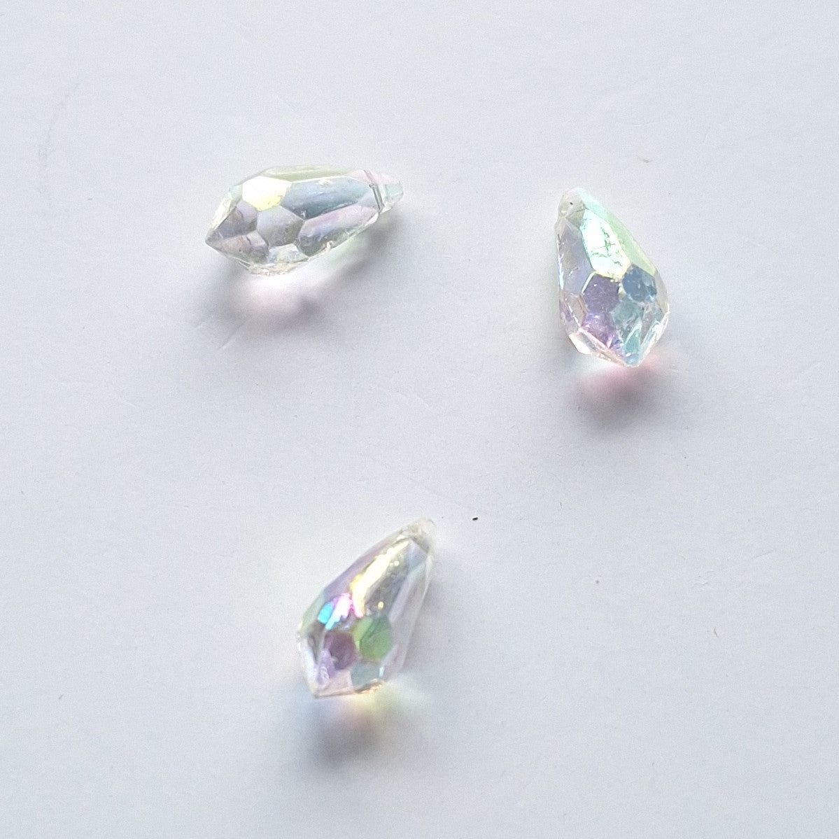 Three AB faceted plastic drop in Crystal, translucent, sew-on, 6.5x13mm.