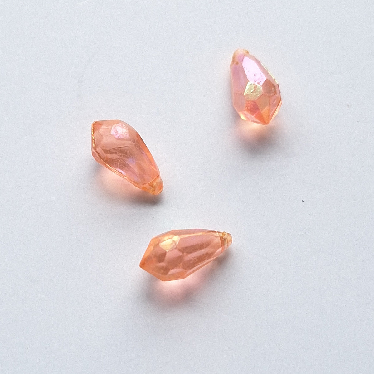 Three AB faceted plastic drop in Dark Pink, translucent, sew-on, 6.5x13mm.